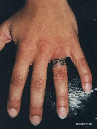 Tribal wedding ring on sale tattoos